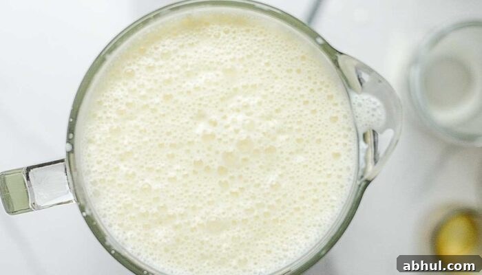 Raw eggnog blended in a blender.