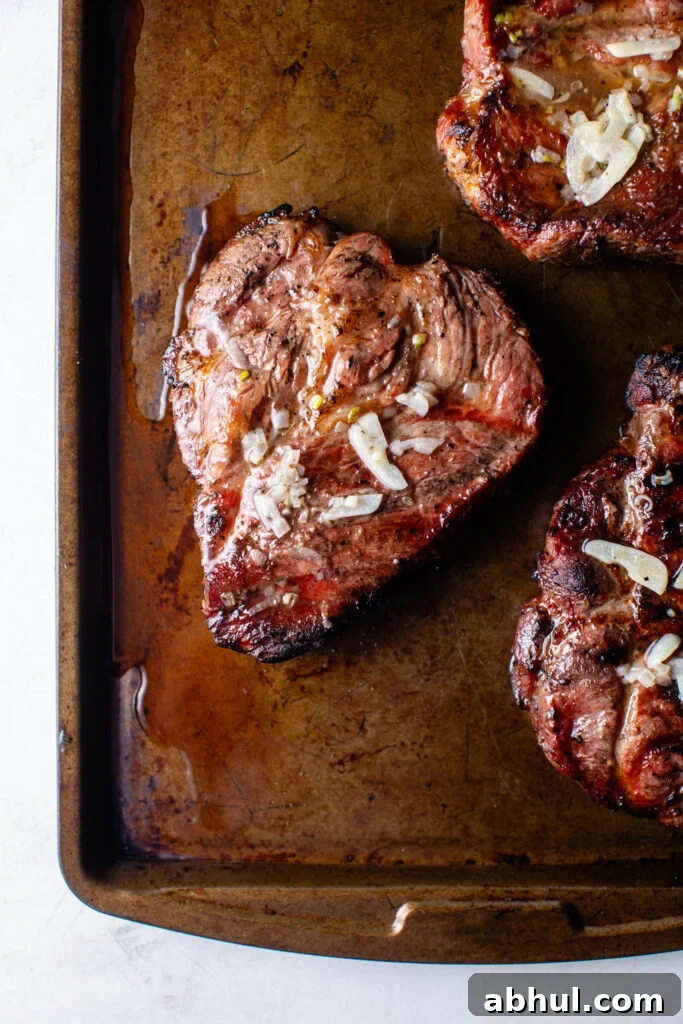 grilled pork coppa steaks with roasted garlic
