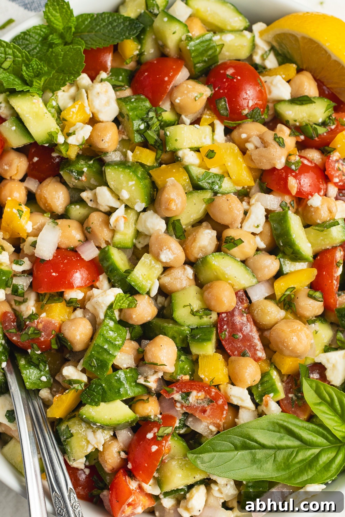 This is a picture of s a bowl of chickpea feta cucumber salad.