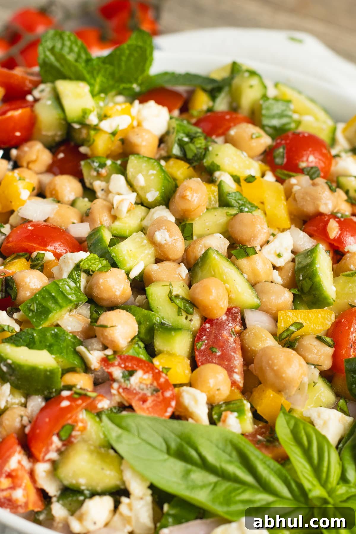 This is a picture of s a bowl of chickpea feta cucumber salad.