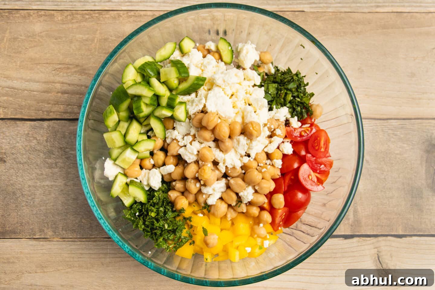 This is a picture of s a bowl of chickpea feta cucumber salad.