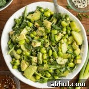 This is a picture of a bowl of edamame cucumber salad.