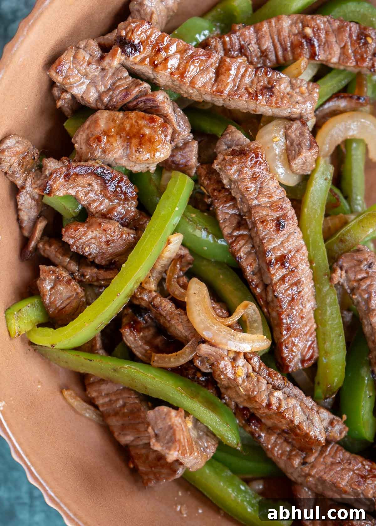 Philly Cheesesteak Wrap Recipe: Quick Steak & Cheese Wraps 7 bowl of seared steak, peppers, and onions for steak wraps or quesadillas