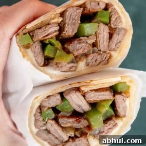Philly Cheesesteak Wrap Recipe: Quick Steak & Cheese Wraps 10 philly cheesesteak wraps with onions, peppers, and cheese in a tortilla
