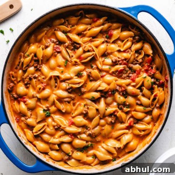 Close up view of one pot cheeseburger pasta in a blue pan.