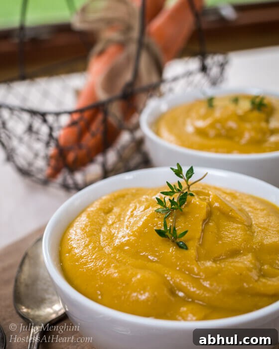 A creamy vegetable soup is not only easy but delicious and healthy too. This soup can also be used as a base for many other recipes. Creamy Roasted Vegetable Soup up close in a white bowl