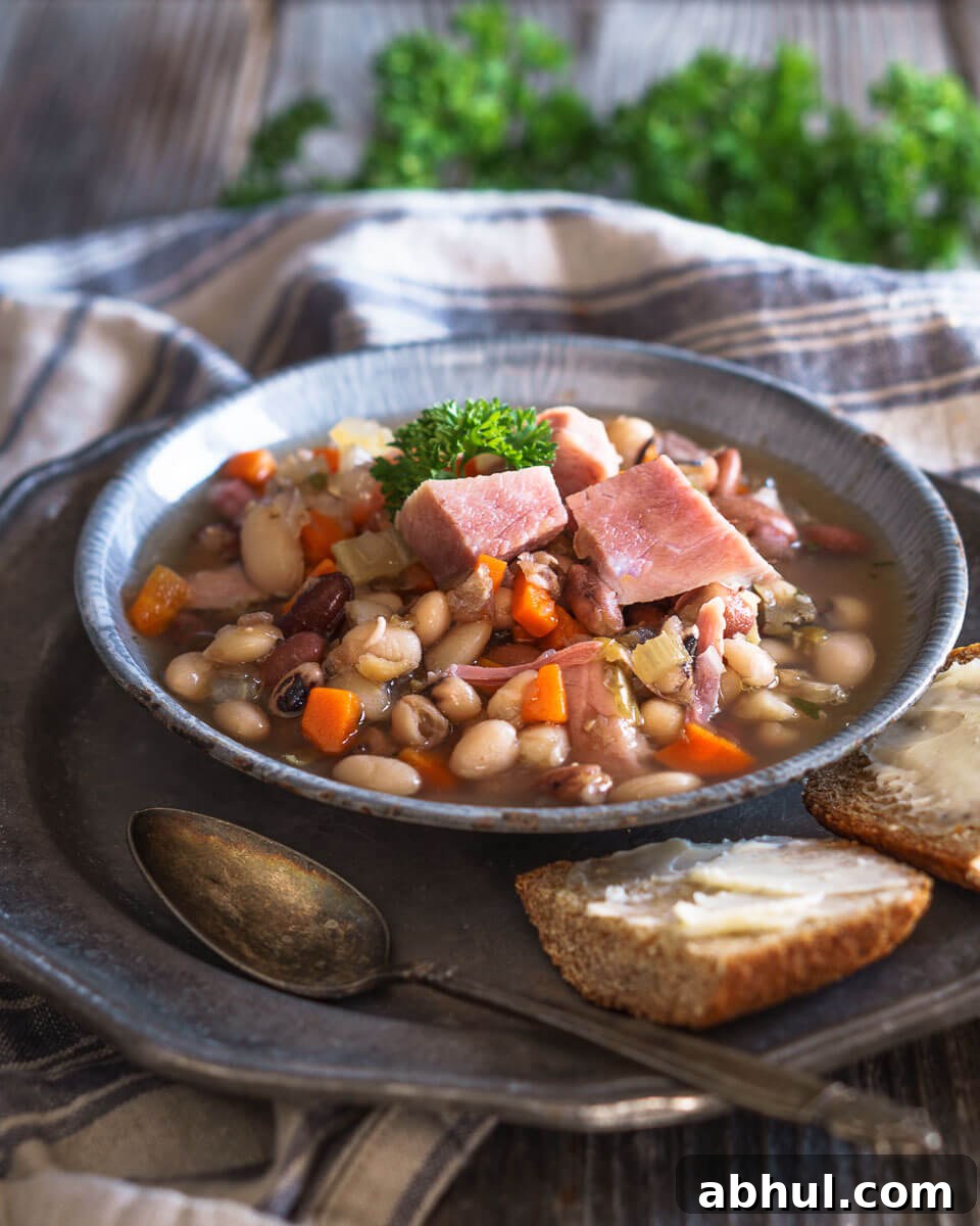 Roasted Vegetable Cream Soup Recipe – Velvety Homemade Flavor 7 Blue granite bowl filled with Ham and Bean Soup