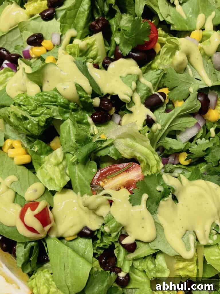 A Mexican chopped salad drizzled with dressing.