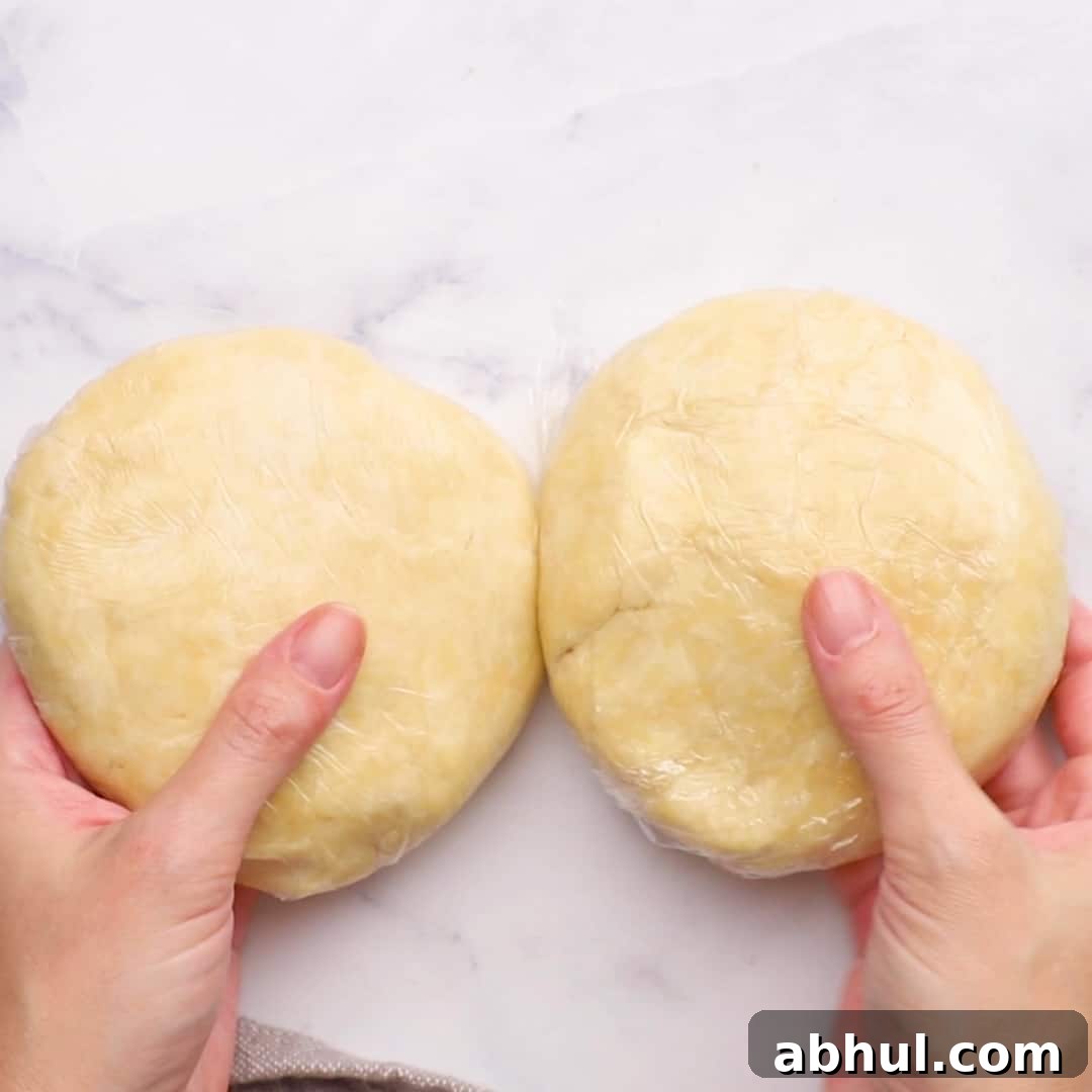 two equal sized balls of pie crust dough 
