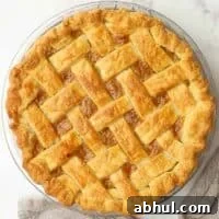 Overhead view of a baked pie with lattice crust.