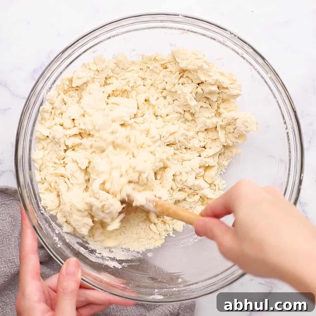mixing the dough with a wooden spoon