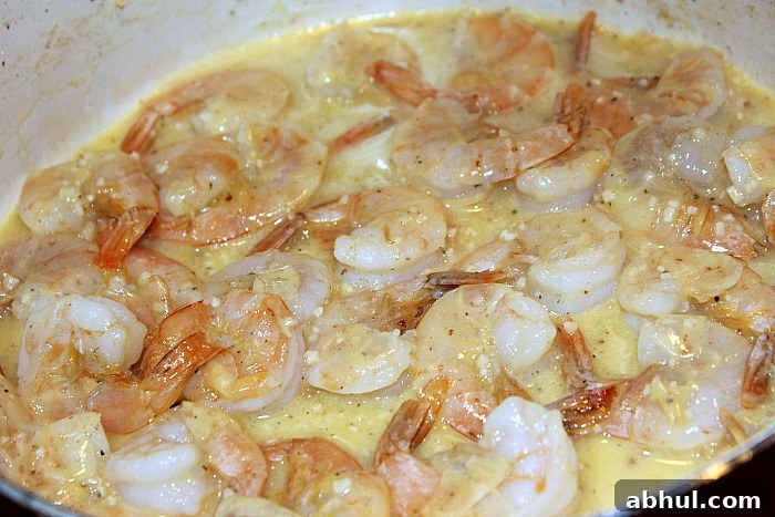 Garlic Butter Grilled Shrimp Skewers cooking in butter garlic 
