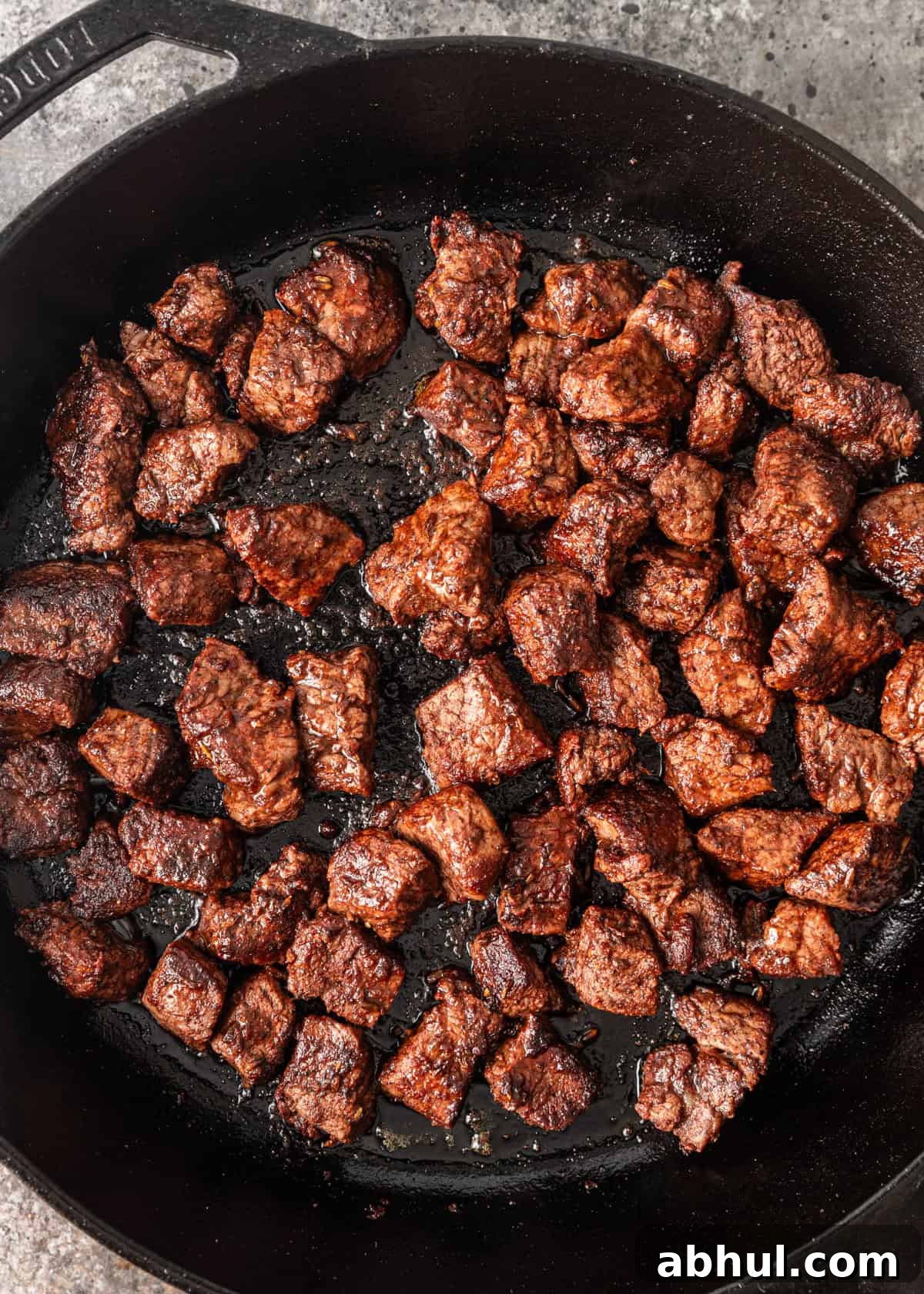 overhead closeup: blackened filet tips cooking in a skillet