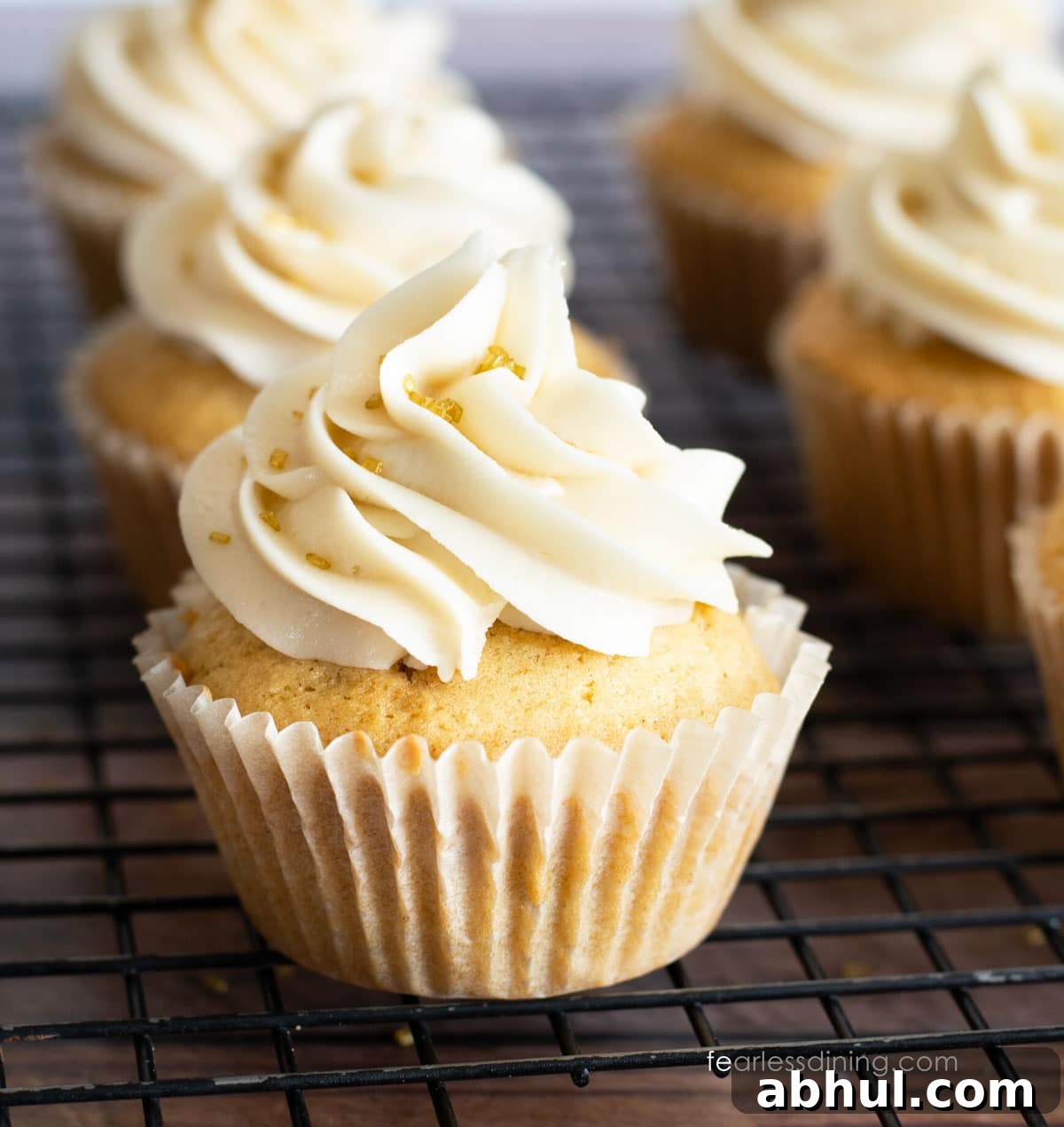 Two rows of frosted gluten free eggnog cupcakes.