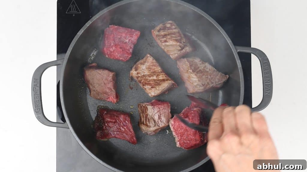 Browning beef in Dutch Oven
