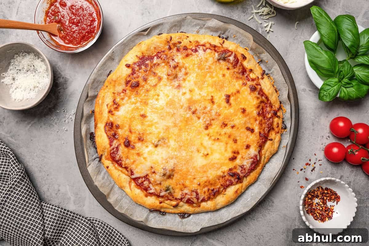 Golden-baked cottage cheese pizza crust topped with melted cheese.