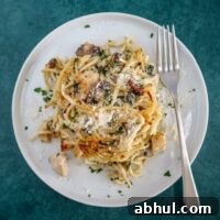chicken tetrazzini with mushrooms, spinach, spaghetti, and parmesan cheese