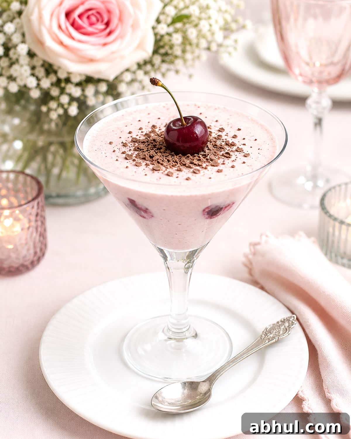 An elegant dinner party dessert - cherry milk jelly in a martini glass.