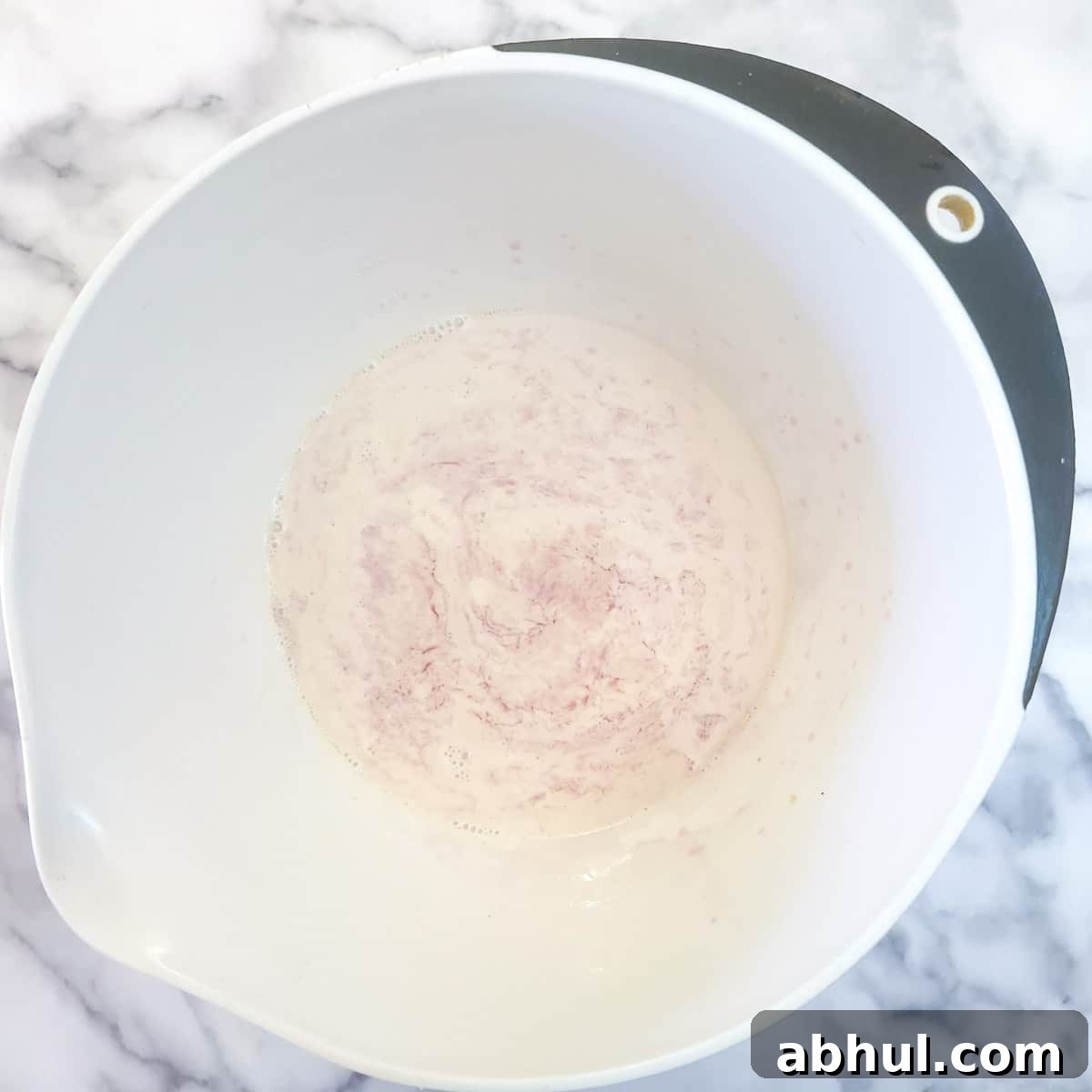 Step 4 - evaporated milk and jelly in a mixing bowl.