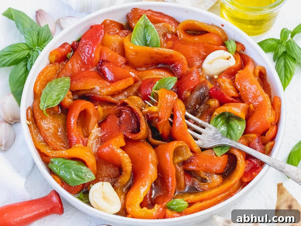 Roasted bell peppers with a fork