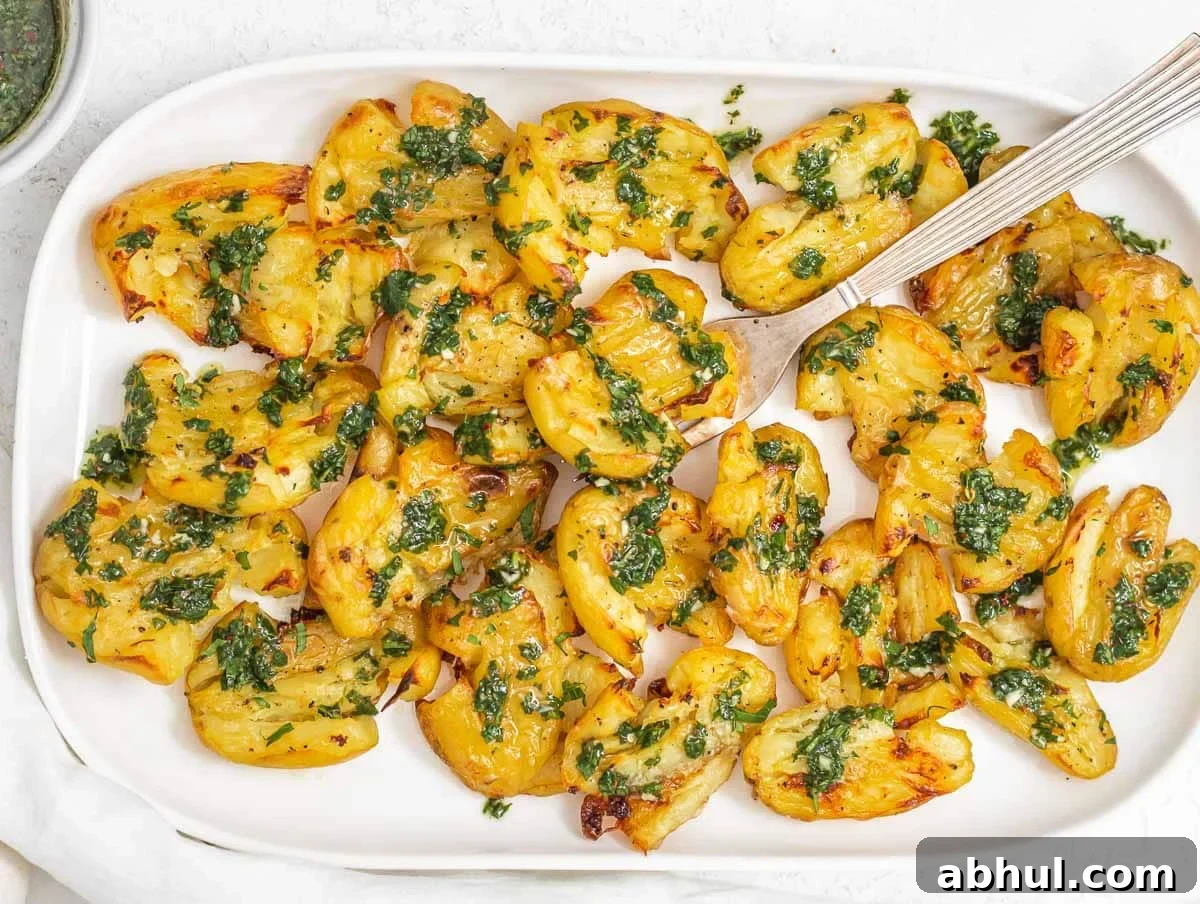 Smashed potatoes and fork