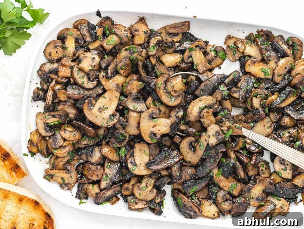 Sauteed mushrooms and white spoon