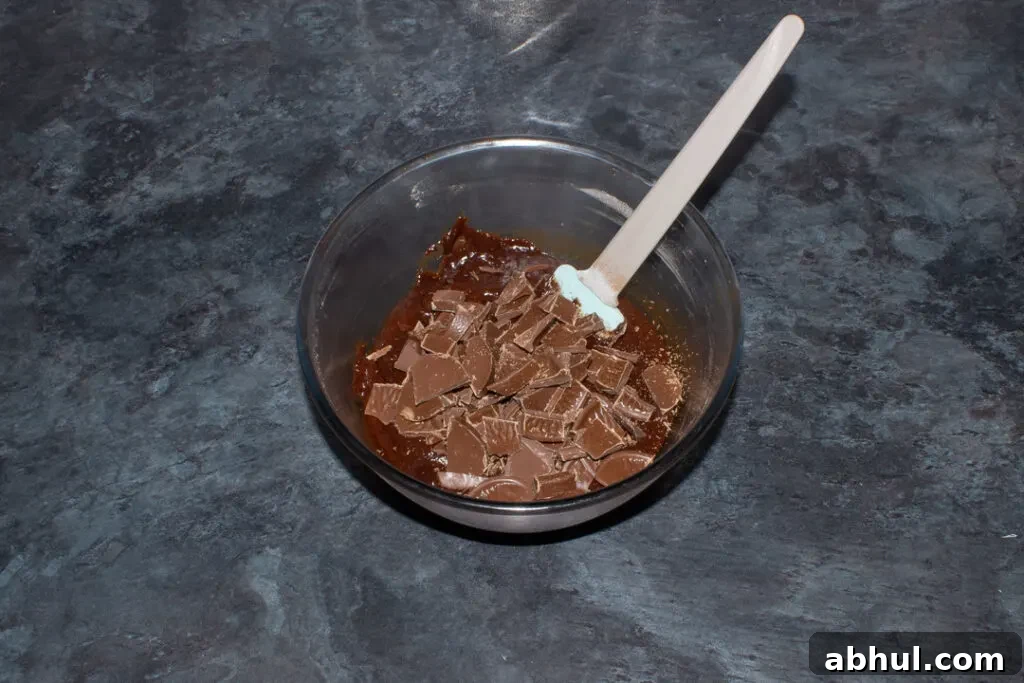 Terry's Chocolate Orange segments being added to brownie batter