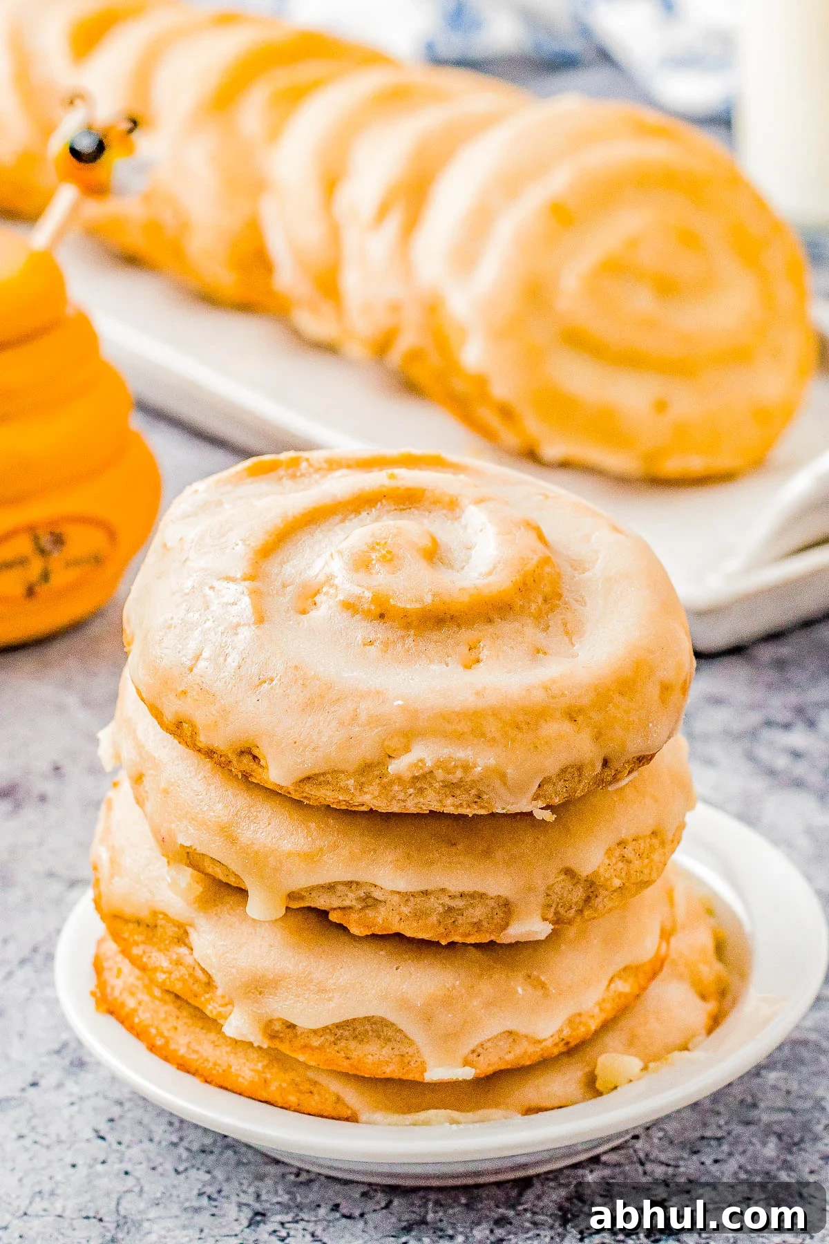 Honey Bun Cookies (Crumbl Cookies Copycat) - Soft and chewy with a warm buttery cinnamon flavor and honey glaze.